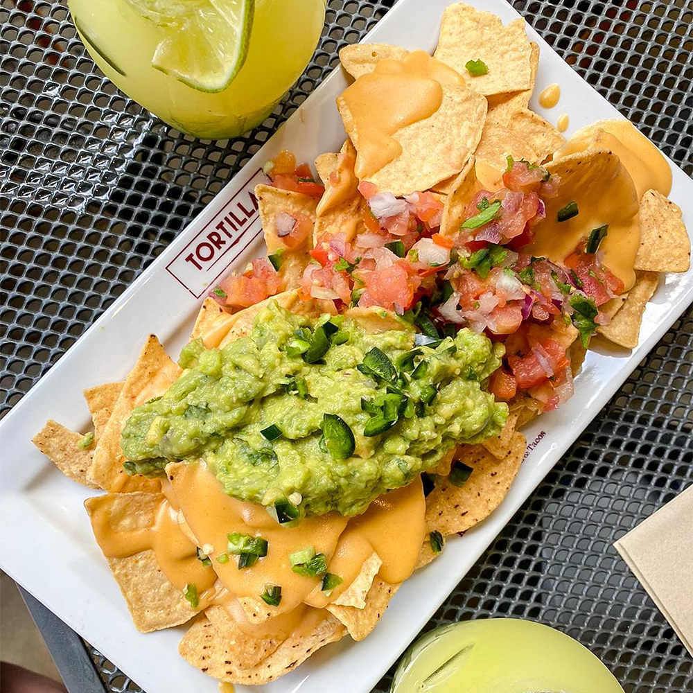 Nachos with dressing from Mexican restaurant and takeaway