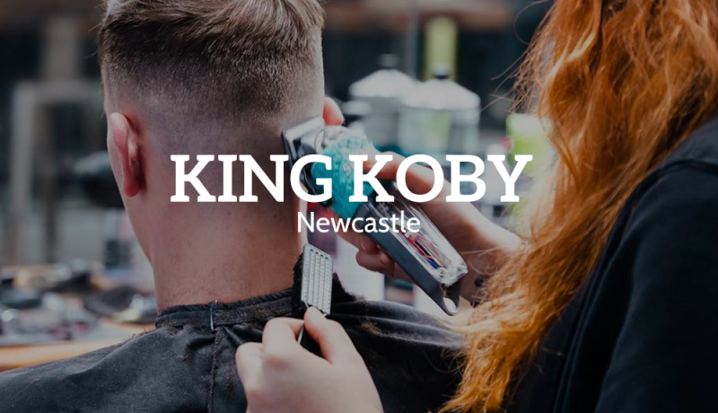 Man receiving new haircut at King Koby