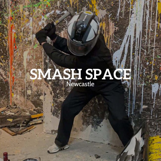 Person mid-hammer swing at a Newcastle rage room